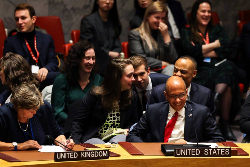 US Deputy Ambassador to the UN Robert Wood (R), flanked by British Ambassdor to the UN Barbara Woodward (L), reacts during a United Nations Security Council meeting on a resolution calling for a ceasefire in Gaza at UN headquarters in New York on December 8, 2023. The United States vetoed a UN Security Council resolution that would have called for an immediate ceasefire in the intense fighting between Israel and Hamas in Gaza. The United States' deputy representative at the UN, Robert Wood, said the resolution was "divorced from reality" and "would have not moved the needle forward on the ground." (Photo by Charly TRIBALLEAU / AFP)
