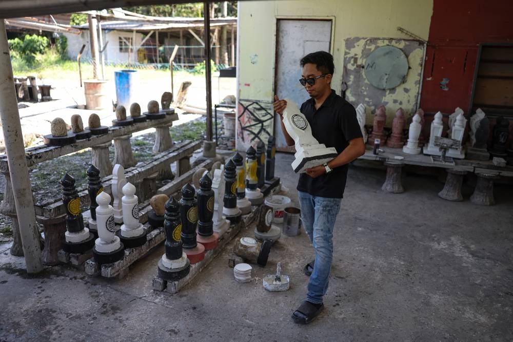Amir said that the tombstones produced by his family's company received demand from as far as Sabah and Sarawak. - Photo by Bernama