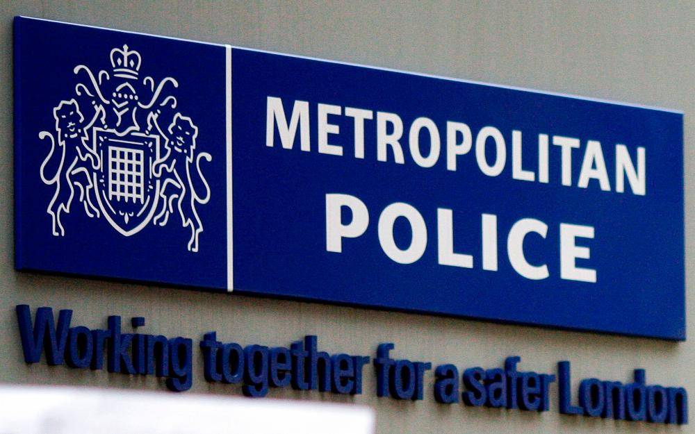 This file photo taken on April 16, 2009 show the Met Police sign outside New Scotland Yard in central London. - FILE PIX by AFP