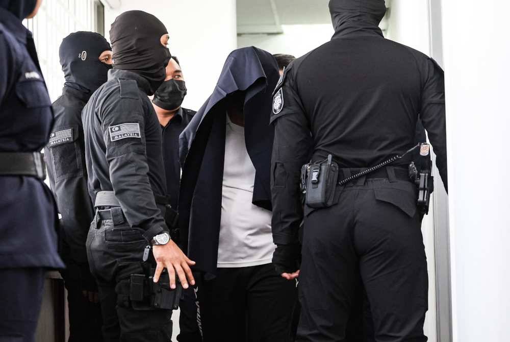 Nazri, whose rank is DSP is accused of causing the death of Zaharif near Sekolah Menengah Kebangsaan Jati here between 12.05 pm and 12.40 pm on Dec 15. Photo by Bernama