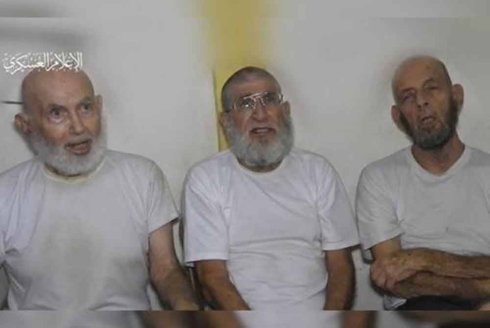 The video showing Chaim Peri, Amiram Cooper and Yoram Metzger alive, seated side-by-side. Photo: X/Trey Yingst