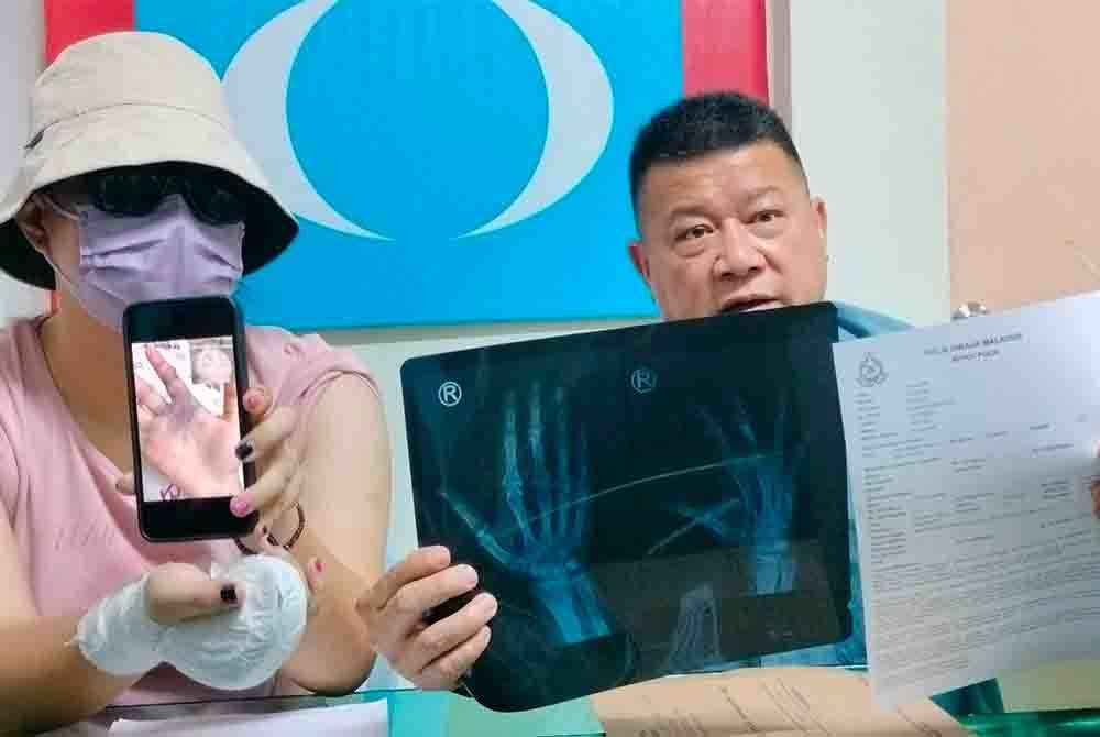 Miss Yuan and Chon Siang at a press conference at the Teruntum assemblyman's office here on Tuesday. - FILE PIX