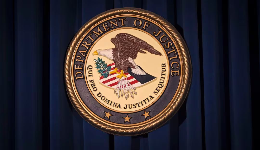 The Department of Justice (DOJ) logo is pictured on a wall after a news conference in New York December 5, 2013. (WIRES FILE PHOTO) 
