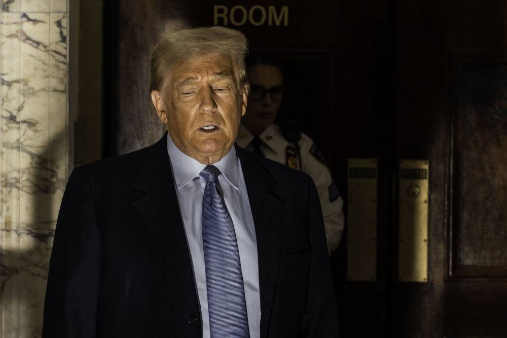 Former US President Donald Trump speaks to reporters as he takes a break during his civil fraud trial in New York City on October 18, 2023. - Photo by AFP