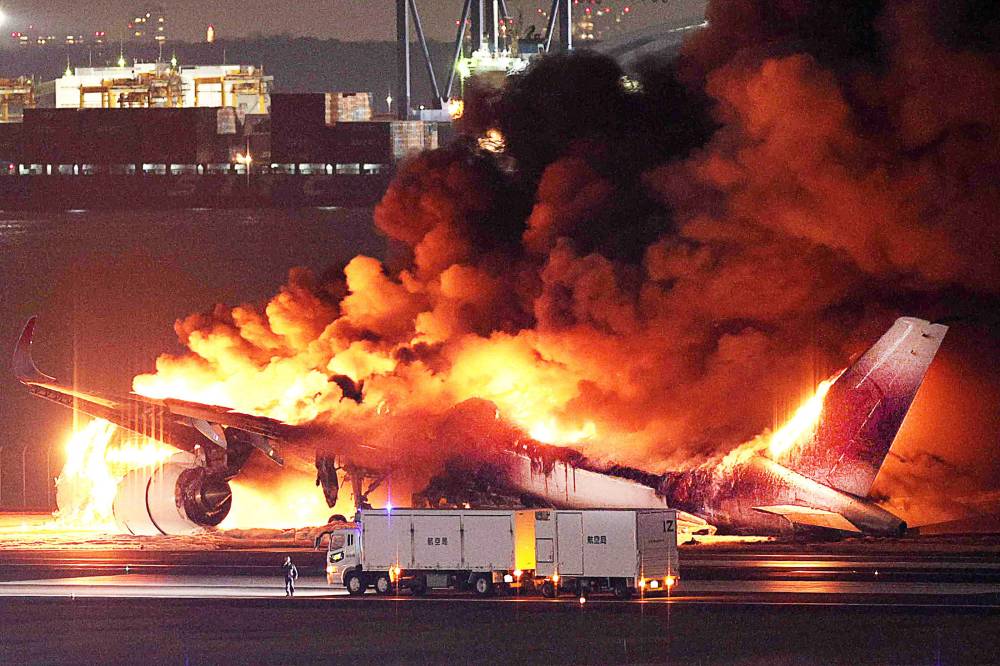 Japan Airlines plane was in flames on the runway of Tokyo's Haneda Airport after apparently colliding with a coast guard aircraft, media reports said. Photo by Jiji Press/Japan