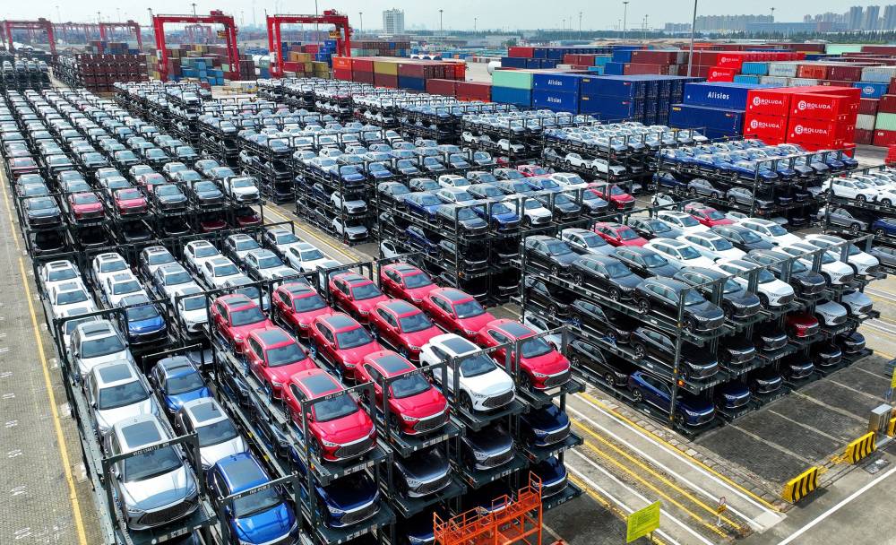 BYD electric cars waiting to be loaded on a ship stacked at the international container terminal of Taicang Port at Suzhou Port, in China. AFP FILE PIX
