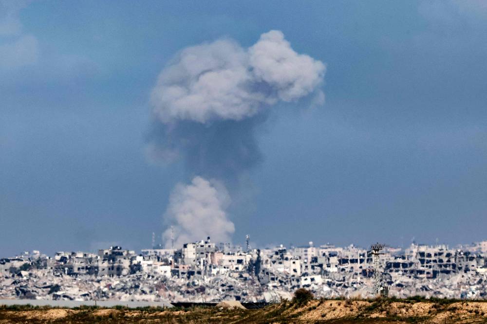 A picture taken from a position in southern Israel along the border with the Gaza Strip, shows smoke billowing over the Palestinian territory during Israeli bombardment on January 4, 2024. - Photo by AFP