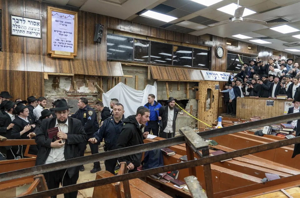 Photos on the scene at the synagogue on Monday, Jan 8, 2024, in New York. (Photo by Bruce Schaff via AP)