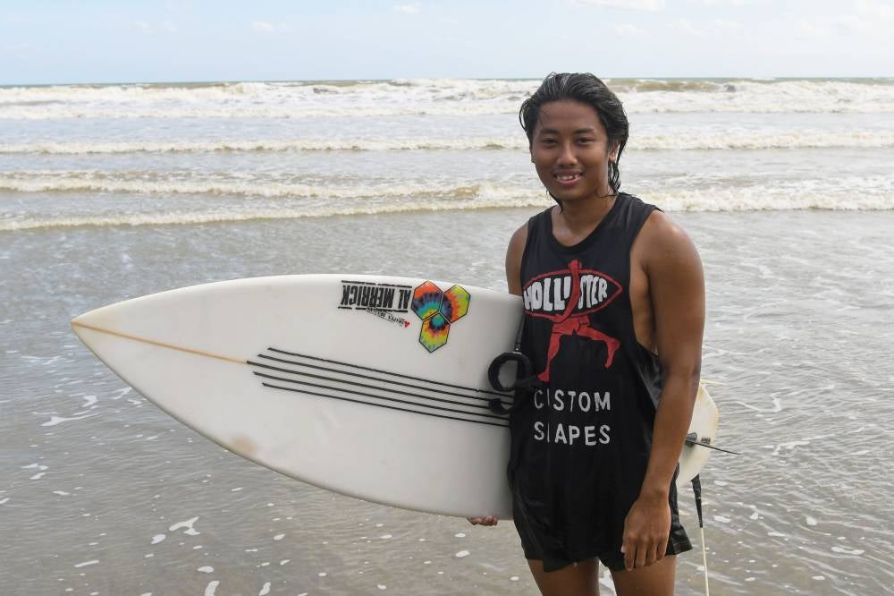 Fazreen is one of the three founders of Kemasin Surfing Club. Photo by Bernama
