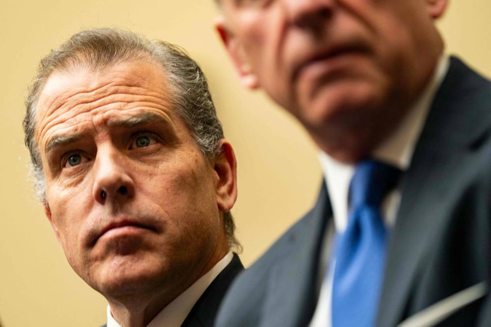 Hunter Biden, son of US President Joe Biden, flanked by Kevin Morris, left, and Abbe Lowell, right, attend a House Oversight Committee meeting on January 10, 2024 in Washington, DC. - Photo by AFP