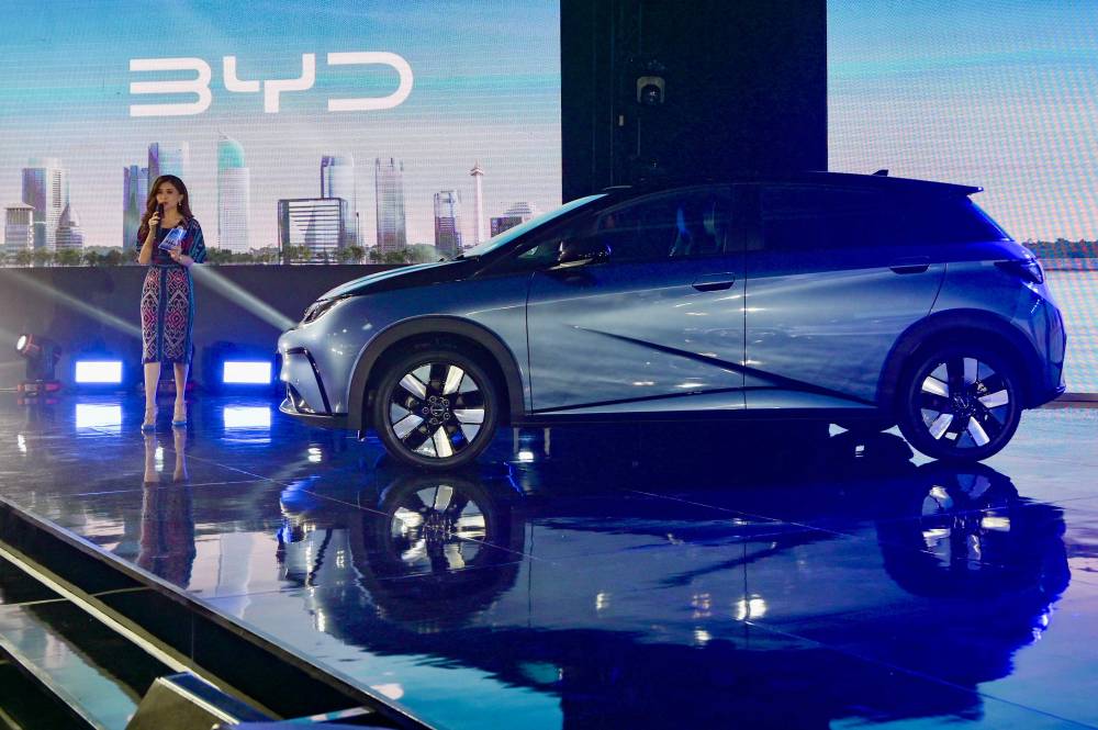Newly launched BYD Dolphin is displayed during the launch of the Chinese-made BYD brand in Jakarta, on January 18, 2024, and at the same time introduced 2 other types of battery-powered vehicles (EV, electric vehicle) that will be sold in Indonesia, with an investment of 1.3 billion US dollars. - Photo by AFP