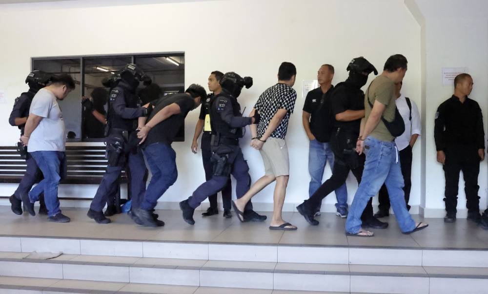 Some of the individuals charged today with being members of organised crime group 'Geng Upik’ between 2015 and last year. - Photo by Bernama