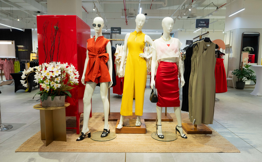 Embrace a modern approach to fashion by defying traditional reds with darker shades for a chic look that goes beyond the Lunar New Year season. Choose the Mina Padded Tweed Mandarin Collar Jumpsuit for after-parties and dinner outings or go for the Mira Knit Midi Dress with a front hook and cutout for a contemporary twist on the classic cheongsam, featuring a back slit for an extra flair.