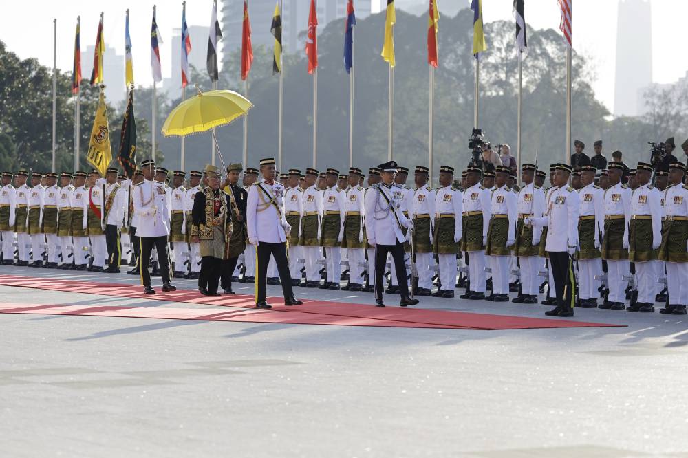Al-Sultan Abdullah then inspected the main guard-of-honour. Photo by Bernama