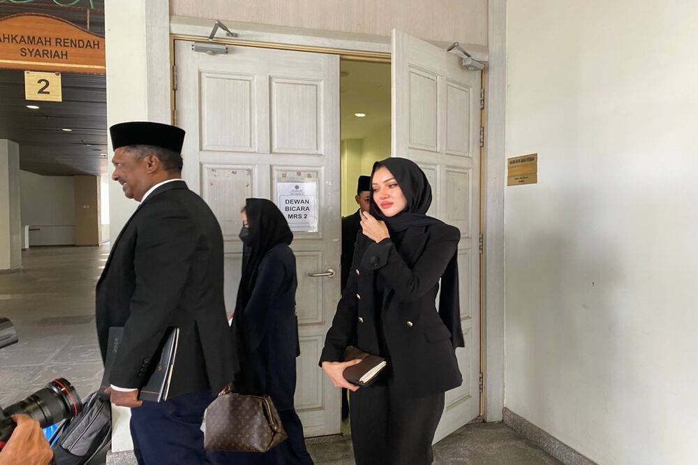 Syarie lawyer Datuk Akberdin Abdul Kader (left) and Cleopatra (right). - Photo by WAN AHMAD ATARMIZI