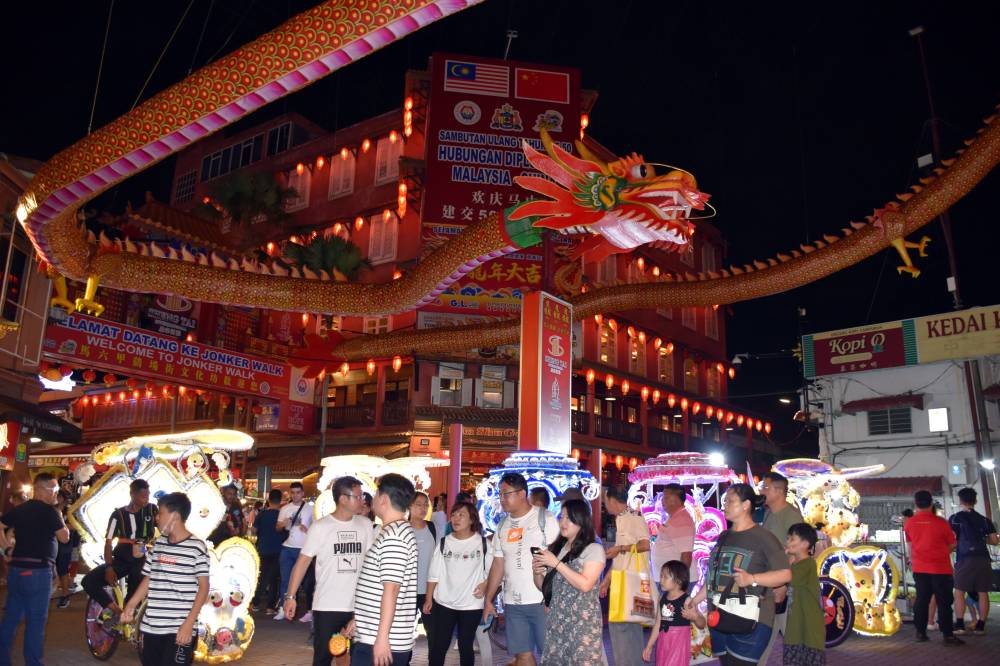 A giant replica dragon installation, measuring 82m in length, is situated at the entrance of Melaka's Jonker Walk for the Chinese New Year season this year. - Photo by Bernama