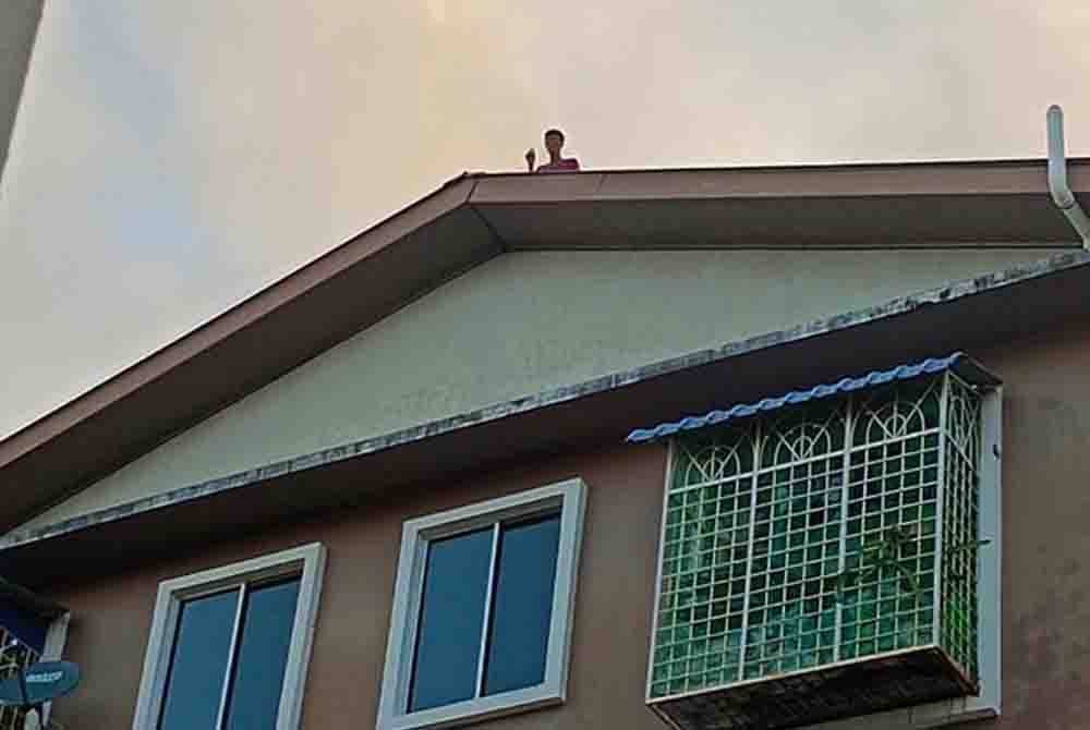 Residents of the apartment are anxious after pleas for the 39-year-old man, known as Jinjing, to come down safely have been ignored.