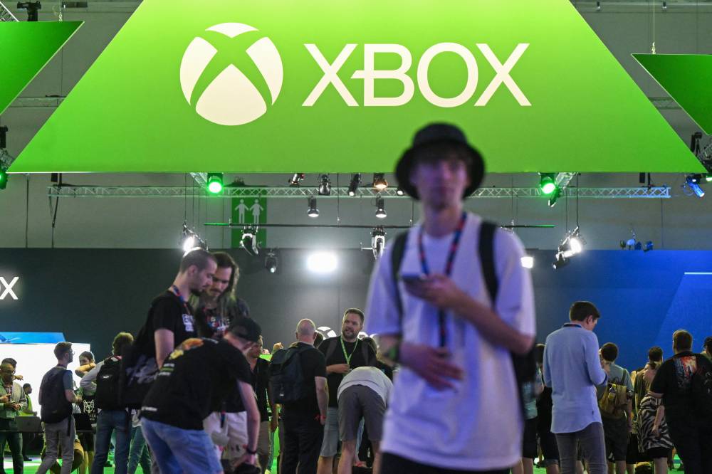 Visitors are seen at the Xbox booth at the Gamescom video game fair in Cologne, western Germany, on Aug 23, 2023. (Photo by Ina FASSBENDER / AFP)