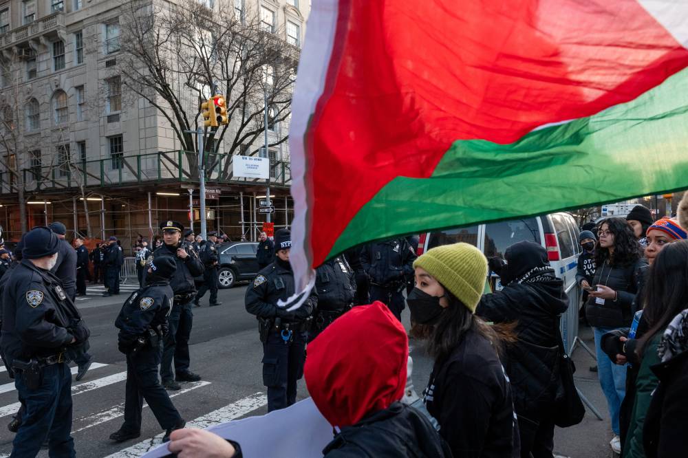 Members of the activist group Jewish Voice for Peace join others in protesting President Joe Biden's visit to Manhattan due to his continued support for Israel in its war against Hamas in Gaza on Feb 7, 2024 in New York City. - (Photo by SPENCER PLATT / AFP)