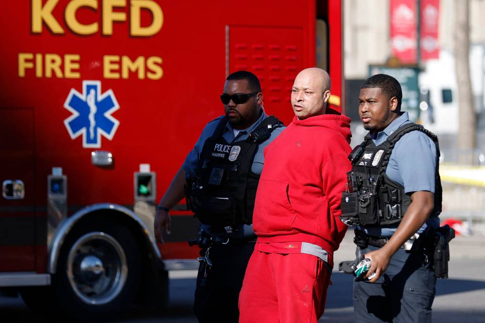 A man is detained by law enforcement following a shooting at Union Station during the Kansas City Chiefs Super Bowl LVIII victory parade on February 14, 2024 in Kansas City, Missouri. Several people were shot and two people were detained after a rally celebrating the Chiefs Super Bowl victory. David Eulitt/Getty Images/AFP (Photo by David Eulitt / GETTY IMAGES NORTH AMERICA / Getty Images via AFP)