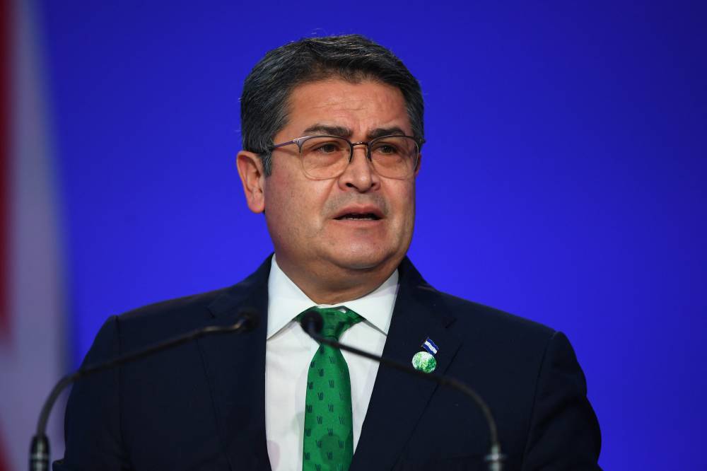 (FILES) Honduras' President Juan Orlando Hernández presents his national statement as part of the World Leaders' Summit of the COP26 UN Climate Change Conference in Glasgow, Scotland on November 1, 2021. Former Honduran President Juan Orlando Hernández reiterated in a public letter on February 19, 2024, that he is 