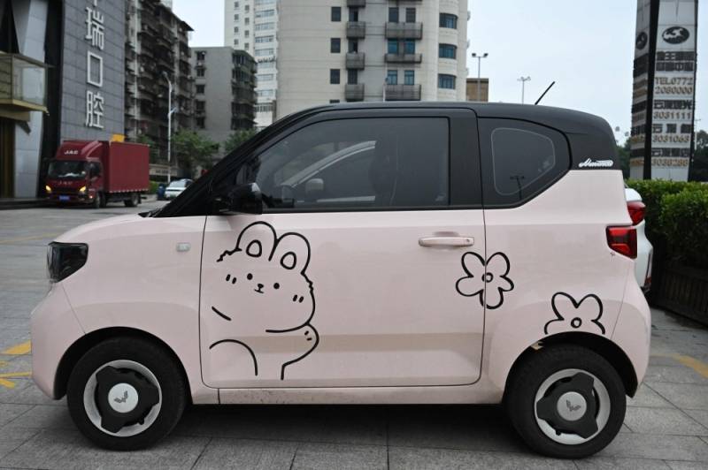 The photo taken on January 24, 2024 shows a decorated mini electric vehicle parking at a parking lot in Liuzhou, in southern China's Guangxi province. — Photo by AFP