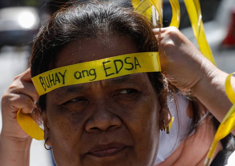 Ahead of the 38th EDSA People Power Revolution anniversary on Feb 25, a gathering was held at the shrine for a holy mass and a demonstration to express opposition to charter change (Cha-Cha) in the Philippine Constitution through a people’s initiative. (Photo by EPA/ROLEX DELA PENA)