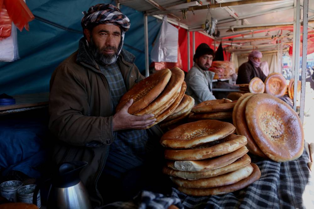 This photo taken on Feb. 21, 2024 shows pieces of naan, Afghan traditional flat bread, at a market in Kabul, Afghanistan. (Photo by Saifurahman Safi/Xinhua)