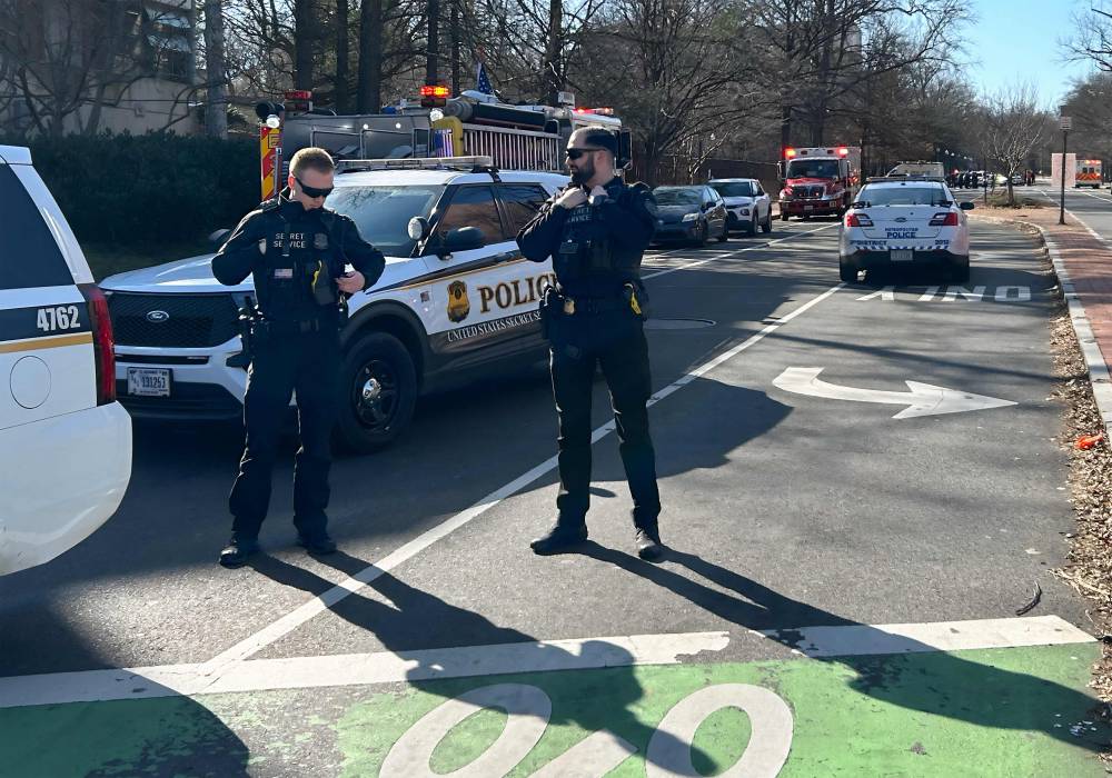 Members of the US Secret Service uniformed division block access to a street leading to the Embassy of Israel in Washington, DC on February 25, 2024. A man reportedly set himself on fire near the embassy on Sunday afternoon. - Photo by AFP