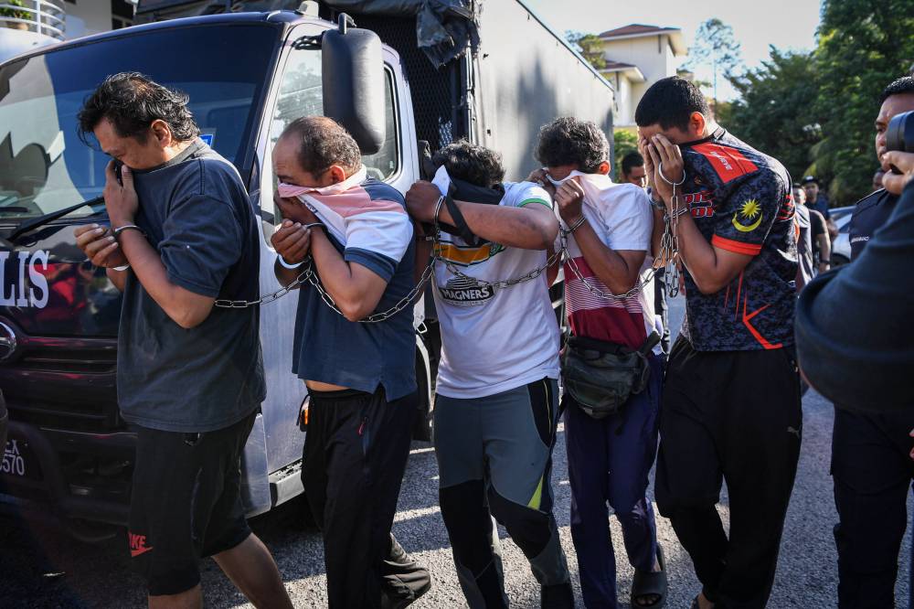 Five food delivery riders were charged today in the Bandar Baru Bangi Magistrate's Court here with the murder of a motorist in Taman Pelangi Semenyih 2 last week. - Photo by Bernama
