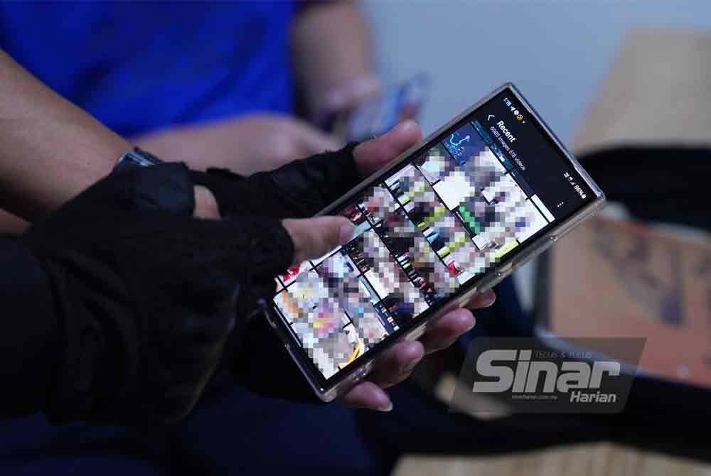 A mobile phone which was confiscated from a suspect revealed several images of undocumented immigrants, along with receipts suspected to be related to the illegal activities. - Photo by MOHD HALIM ABDUL WAHID