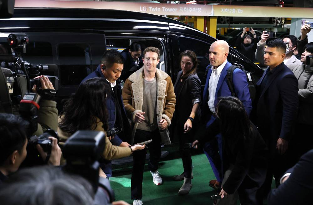 Mark Zuckerberg (C) arrives at the underground parking lot of LG Twin Tower during his visit to South Korea on the second leg of his Asia trip in Seoul on Feb 28, 2024. Photo by Yonhap/AFP