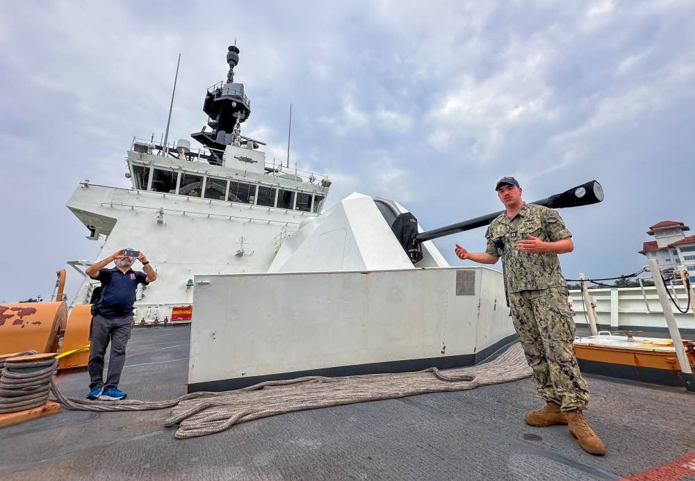 United States Coast Guard crew giving a tour of the vessel to members of media 