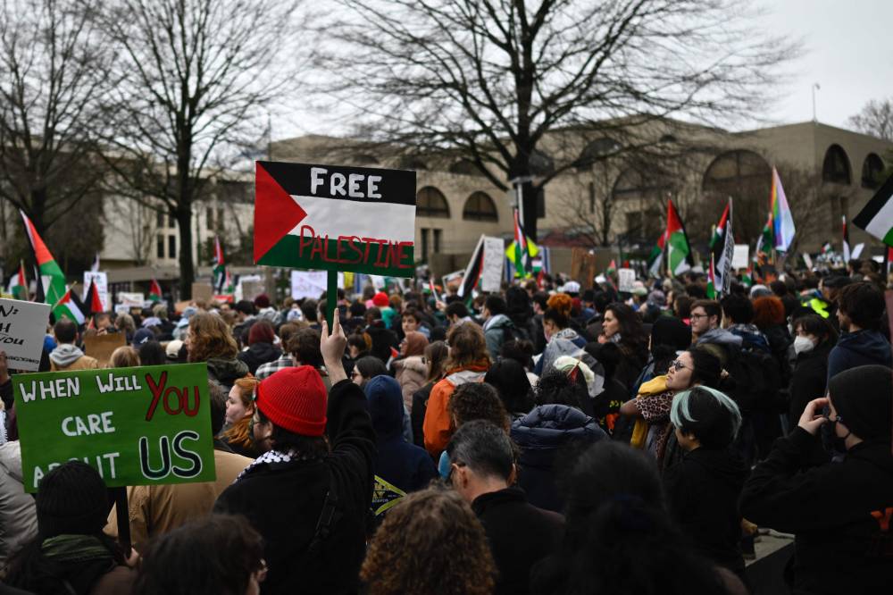 People supporting Palestine, take part in a protest against Israel, in front of the Israeli embassy in Washington, DC, on March 2, 2024. - Photo by AFP