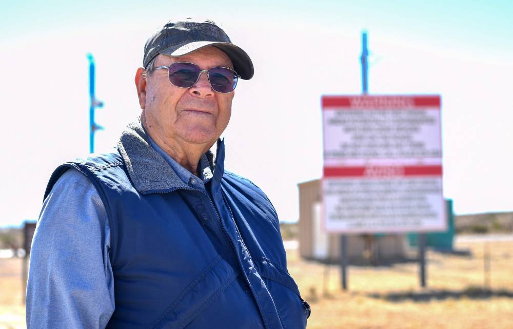 Wesley Burris poses for a portrait in front of the entrance of White Sands Missile Range where Trinity test site is located, near White Sands, New Mexico, on February 21, 2024. Burris was fast asleep in bed when the world's first atomic bomb exploded just 25 miles (40 kilometers) from his front door. The events of 5:30 am on July 16, 1945 are now best known to millions from their dramatic re-enactment in the Oscar-tipped movie 