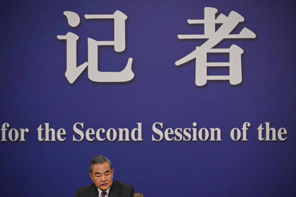 China's Foreign Minister Wang Yi attends a press conference for the Second Session of the 14th National People’s Congress (NPC) in Beijing on March 7, 2024. (Photo by AFP)