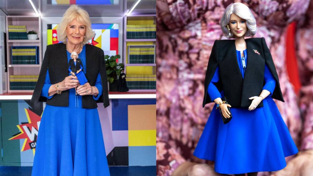 Britain's Queen Camilla holds a Barbie doll in her image during a reception to celebrate International Women’s Day and mark the end of the Women of the World (WOW) Girls Festival Bus tour at Buckingham Palace, central London, on March 12, 2024. - (Photo by Paul Grover / / AFP)