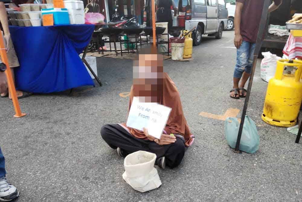 She returned to the same area but in a different location while displaying a placard saying - 