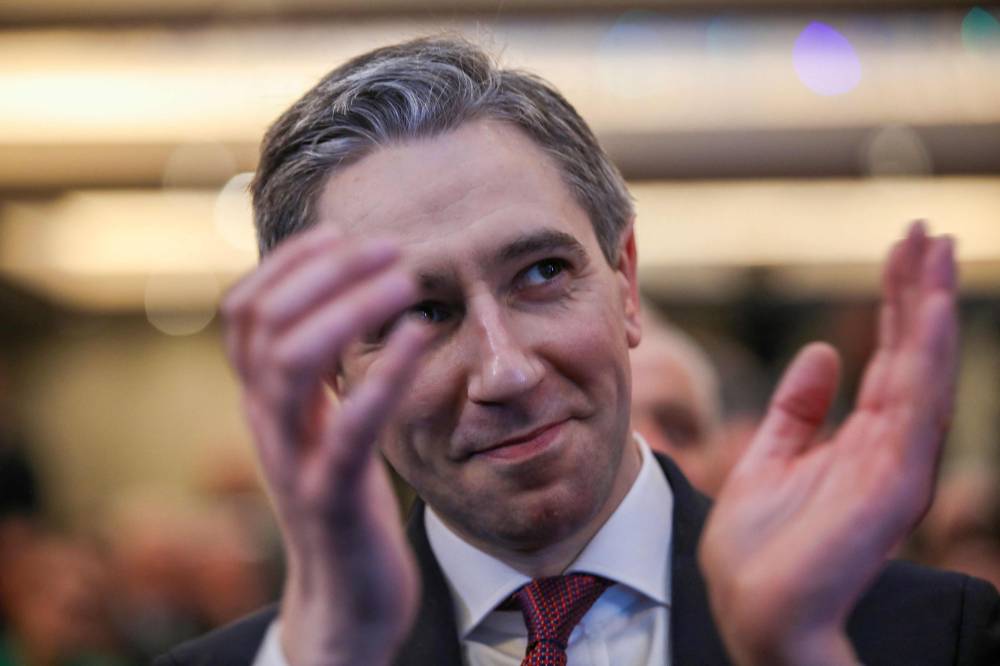 Simon Harris applauds during the Fine Gael convention at the Sheraton Hotel in Athlone, central Ireland on March 24, 2024, before being declared leader and de facto prime minister-in-waiting. - Photo by AFP