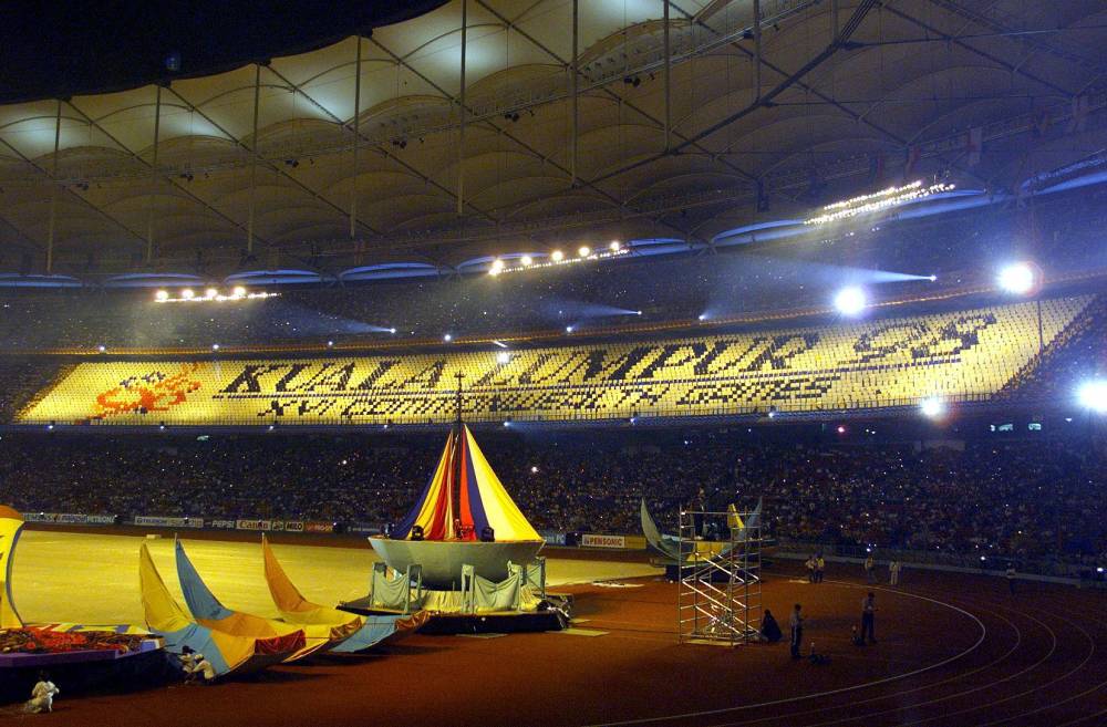 Placards are displayed inside the National Stadium during the Opening Ceremony of the XVI Commonwealth Games in Kuala Lumpur on Sept 11, 1998. (Photo by AFP)