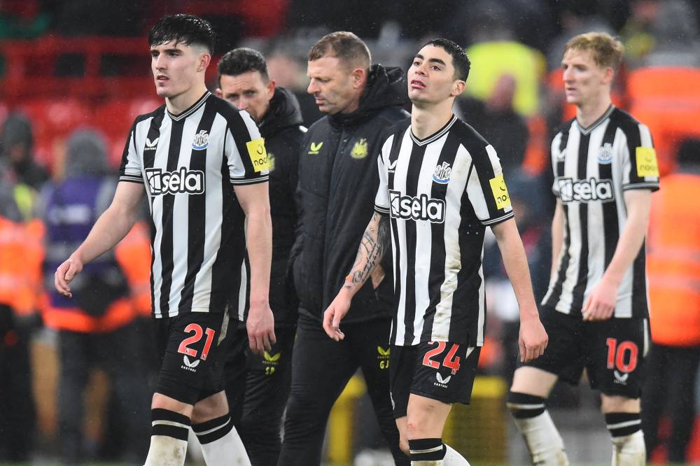 (FILES) Newcastle United's English defender #21 Valentino Livramento (L), Newcastle United's Paraguayan midfielder #24 Miguel Almiron (C) and Newcastle United's English midfielder #10 Anthony Gordon (R) react to their defeat on the pitch after the English Premier League football match between Liverpool and Newcastle United at Anfield in Liverpool, north west England on January 1, 2024. - Photo by AFP