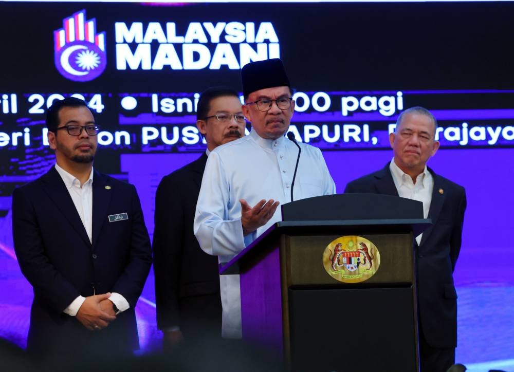 Prime Minister Datuk Seri Anwar Ibrahim (two, right) delivering his speech during the monthly assembly of the Prime Minister's Department at Dewan Sri Endon Puspanitapuri, today. - Photo by Bernama