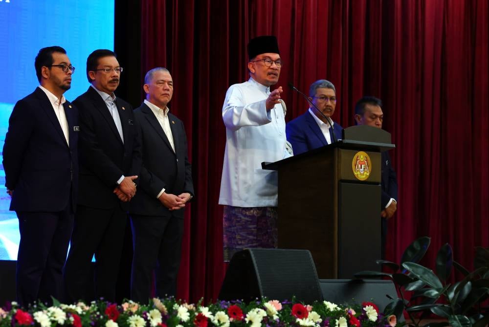 Prime Minister Datuk Seri Anwar Ibrahim (four, left) delivering his speech at the monthly assembly with staff of the Prime Minister's Department (JPM) today. - Photo by Bernama