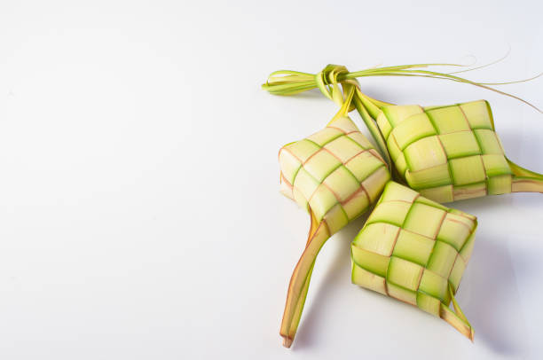 Engage children in the tradition of making ketupat by providing colorful paper, glue, and scissors Photo source: 123RF