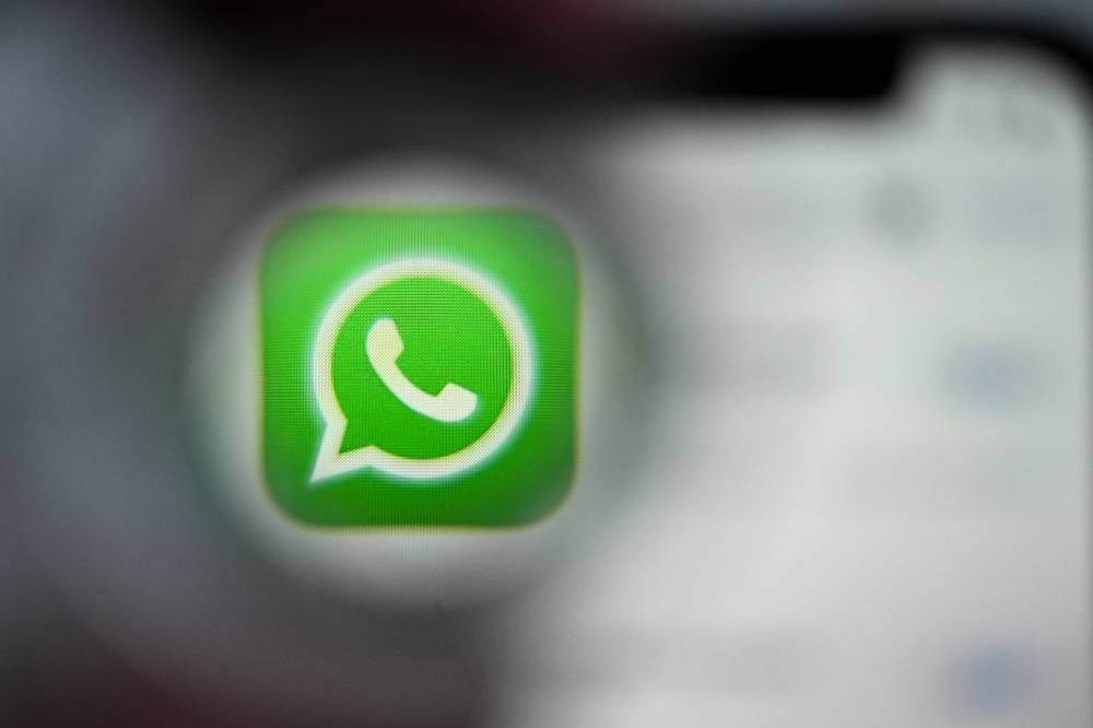 This illustration photograph taken on Dec 22, 2023, shows the logo of US instant messaging software Whatsapp displayed on a smartphone's screen, in Frankfurt am Main, western Germany. - (Photo by KIRILL KUDRYAVTSEV / AFP)