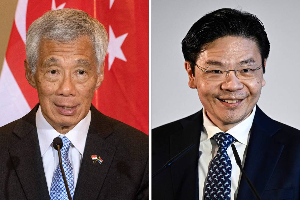 Lee Hsien Loong (left) and Lawrence Wong. Photo by AFP