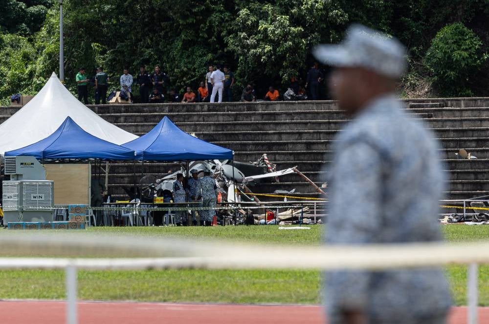 The bodies of the 10 victims involved in the mid-air collision and crash involving two helicopters at the Royal Malaysian Navy (RMN) base in Lumut were recovered earlier today. Photo by Bernama
