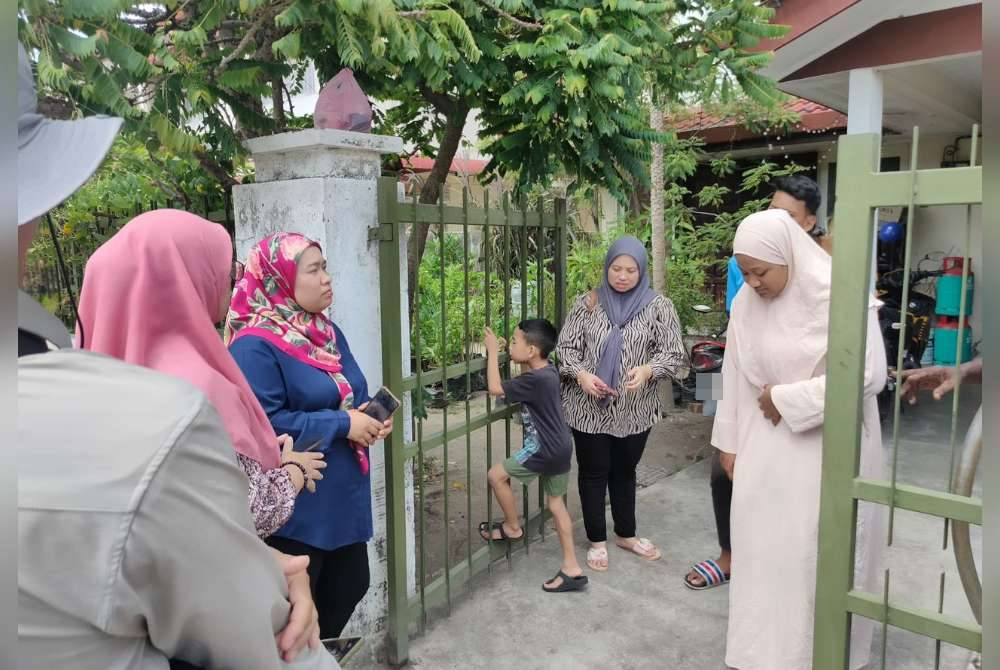 The deceased's family members when met by reporters at their family home on Tuesday.