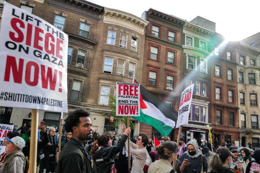 Pro-Palestinian protesters gather outside of Columbia University in New York on April 23, 2024. Tensions flared between pro-Palestinian student protesters and school administrators at several US universities on April 22, as in-person classes were cancelled and demonstrators arrested. (Photo by AFP)