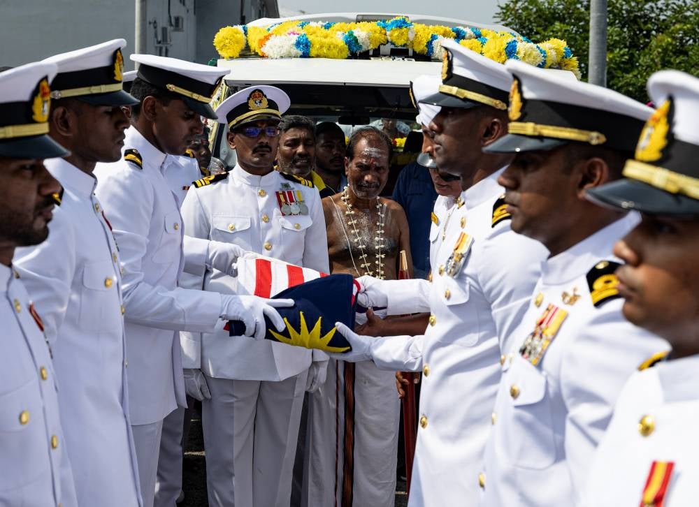A prayer ceremony was held at the family’s home in Taman Serdang Jaya, Sitiawan, starting around 9am. Photo by Bernama